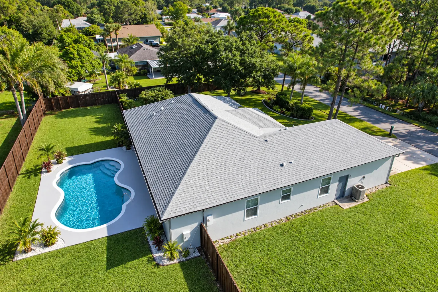 Happy family protected by a premium roof in front of their Florida home