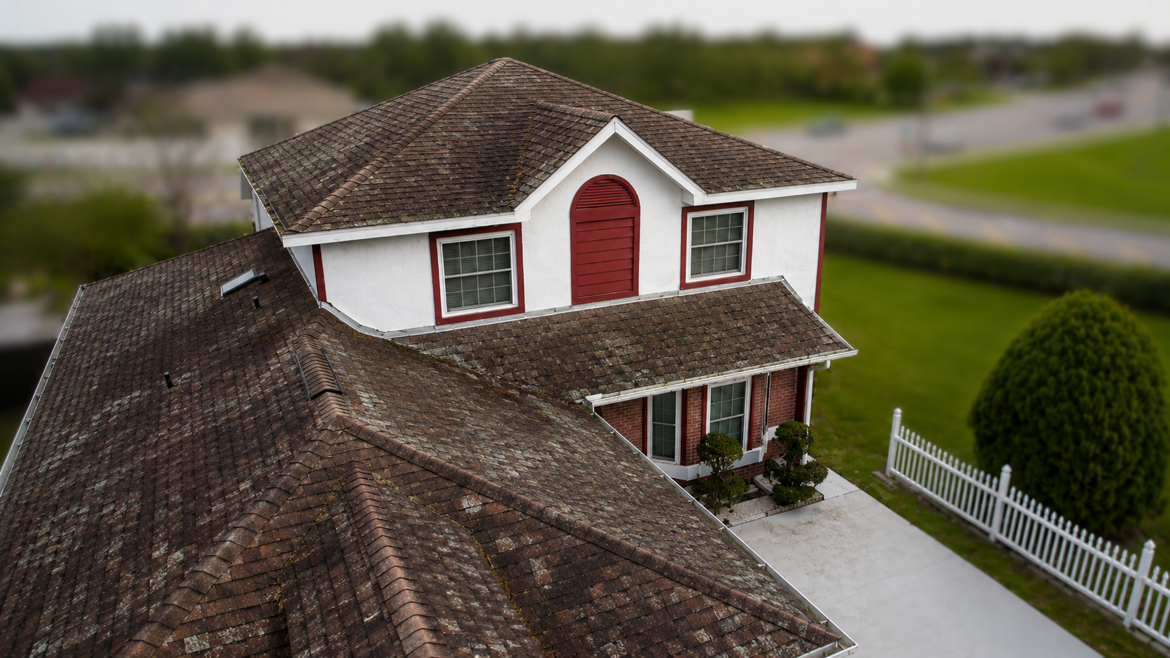 Storm damaged roof before restoration